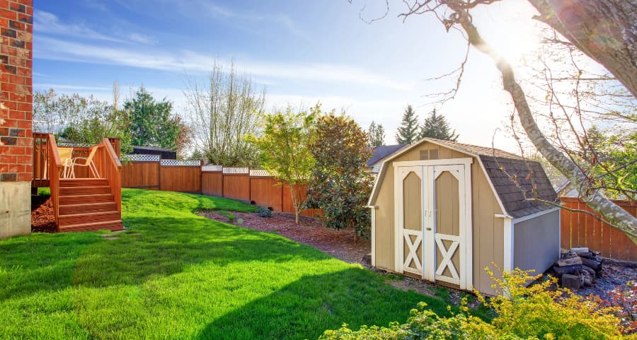 Fenced backyard with storage shed in Columbus